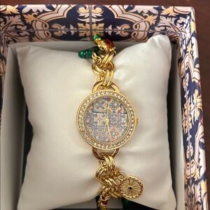 Elegant Gold tone Women's Watch with Crystal Accents and Charms